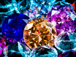 Closeup of colored gemstones against a black background