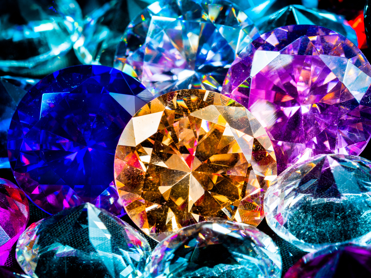 Closeup of colored gemstones against a black background