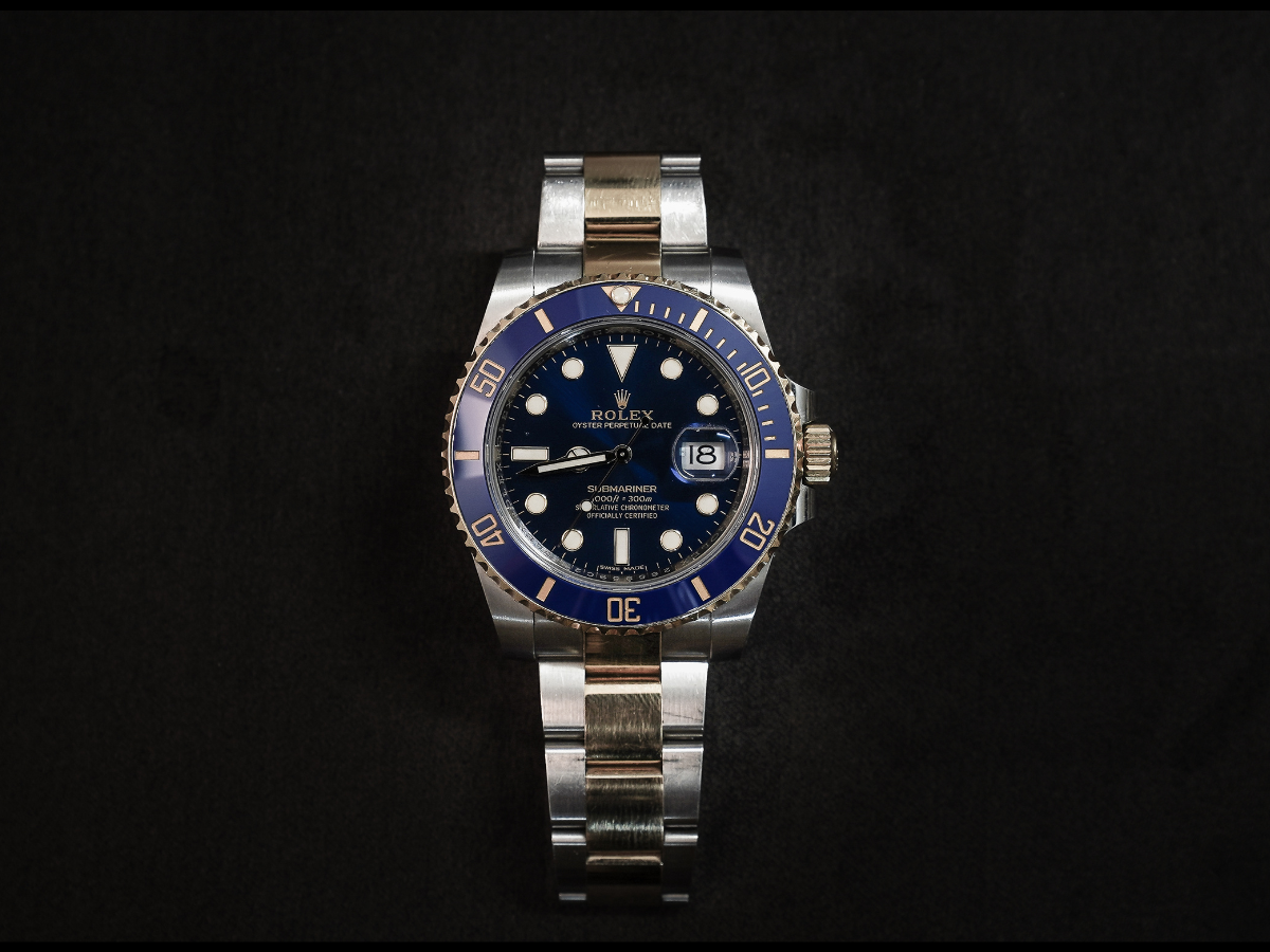 Image of a Rolex against a black background
